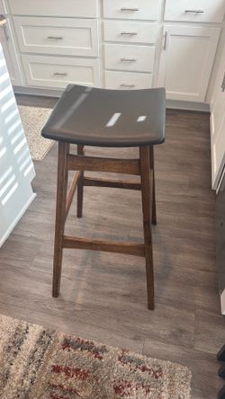 2 brown leather barstools