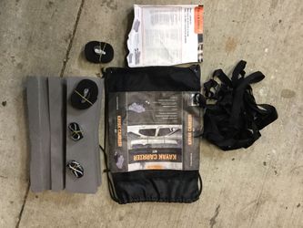 Kayak carrier for car or truck hold down roof rack mount kit.