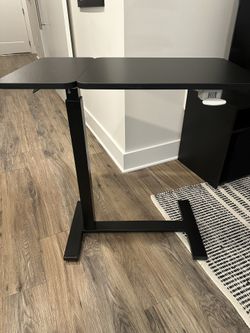 New Black rolling table for bed or standing.