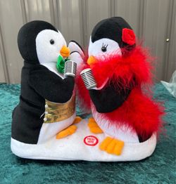Avon Hallmark Singing Penguins Animated Plush.