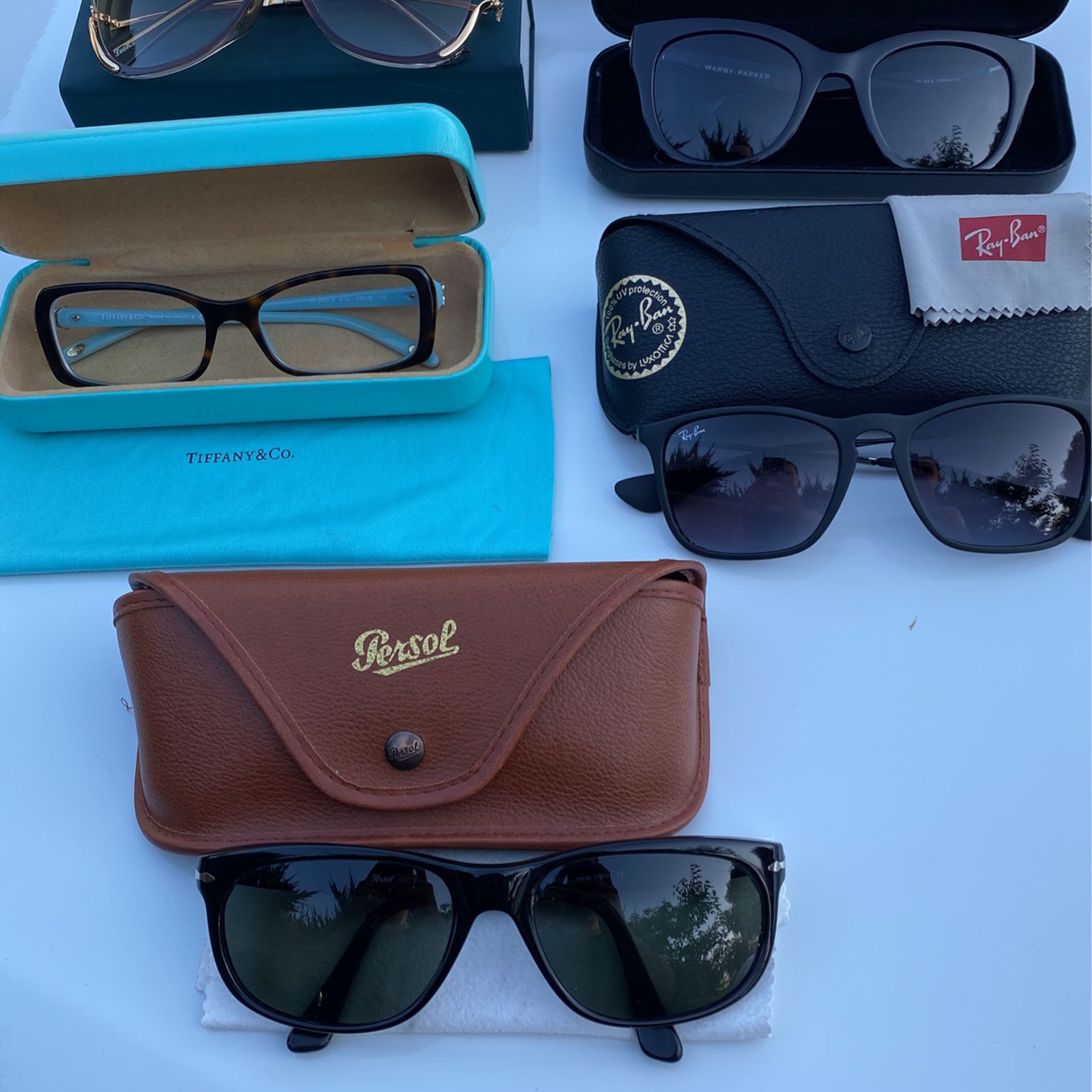Six Pairs Of High Designer Sunglasses All Original Tiffany, Rayban, Persol, Warby Parker, +