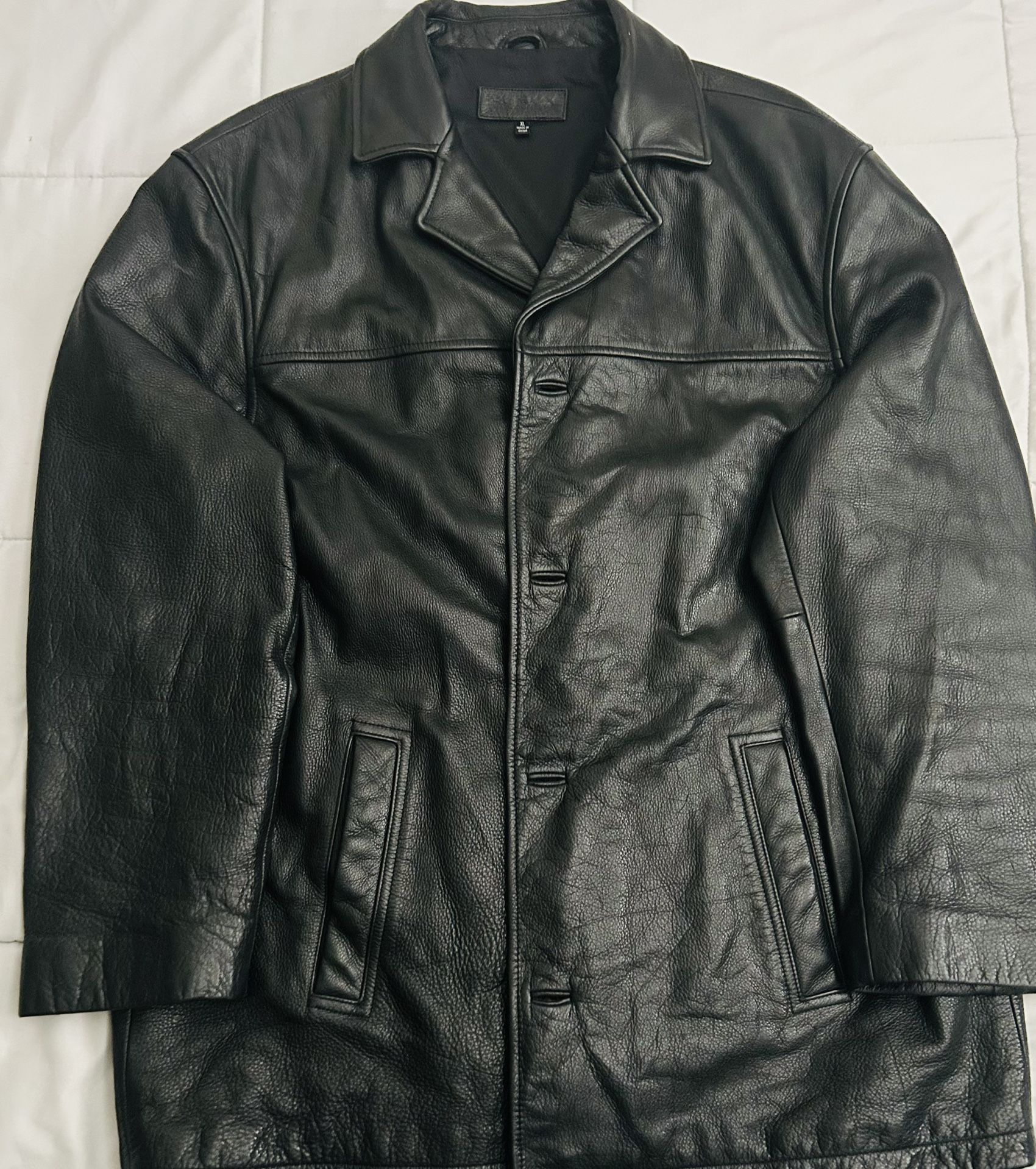The item shown in the image is a men's black leather trench coat jacket by the brand John Ashord XL Size