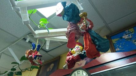 Hanging paper mache clowns
