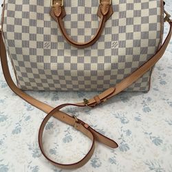 This Is a Louis Vuitton Speedy Bandoulière in the Damier Azur canvas 35 