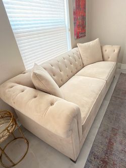 Beautiful tufted cream couch
