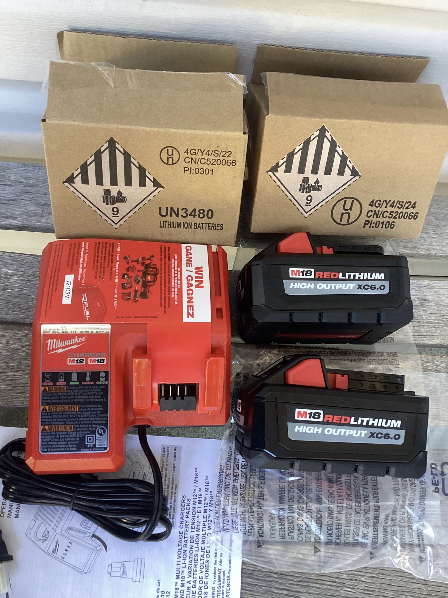 2 Milwaukee M18 Batteries HIGH OUTPUT 6.0 And Charger.   Brand NEW.  NUEVO.