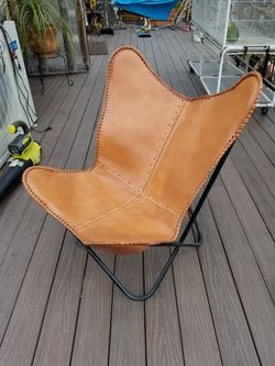 Iron and leather wing chair
