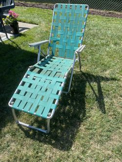 VINTAGE WEBBED CHAISE LOUNGE CHAIR.