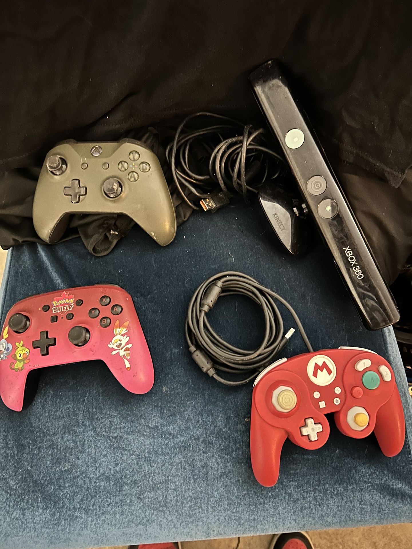 Various Game Controllers And Two Turtle Beach Gaming Headsets