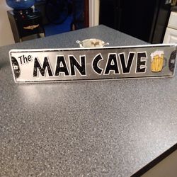 SIGN IS. 24 INCHES LONG. 5 INCHES WIDE NEW STILL WRAPED IN PLASTIC 