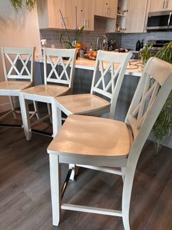 Four high top chairs / bar stools