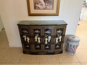 Chinese black lacquer slanted-front cabinet featuring mother-of-pearl inlay and hand-painted detailing