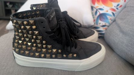 MadeWorn's limited-run footwear line , black studded high tops