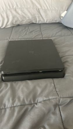 PS4 (black) with power cable and HDMI port