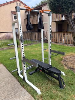 Adjustable squat rack and weights bench with pull up bar , safety spotter arms, j hooks and hanger straps