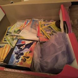 Box full of pokemon cards cases clear cases and gard cases 