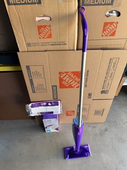 Swiffer Wet Jet Spray Mop with Refill pads.