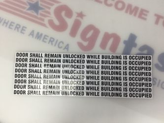 “Door Shall Remain Unlocked While Building Is Occupied” stickers