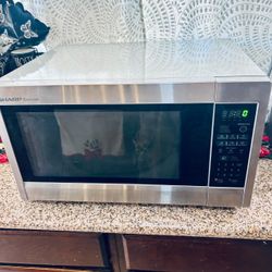 SHARP R651ZS Carousel 2.2-cu ft Countertop Microwave 1200-Watt (Stainless Steel) with Owner’s Manual