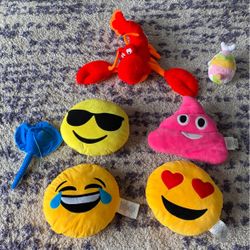 Emoji pillows and other stuffed animals