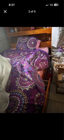 Full size bed with mattress and small dresser