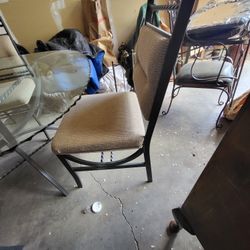 Is rod iron table chairs with glasshop. 