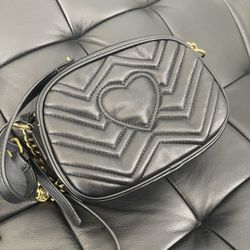Woman’s Black Leather Bag With Gold Chain