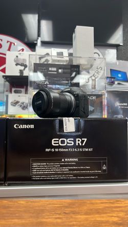 Canon R7 with 18-150mm.  A plus condition
