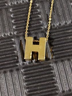 Gold tone "H" necklace