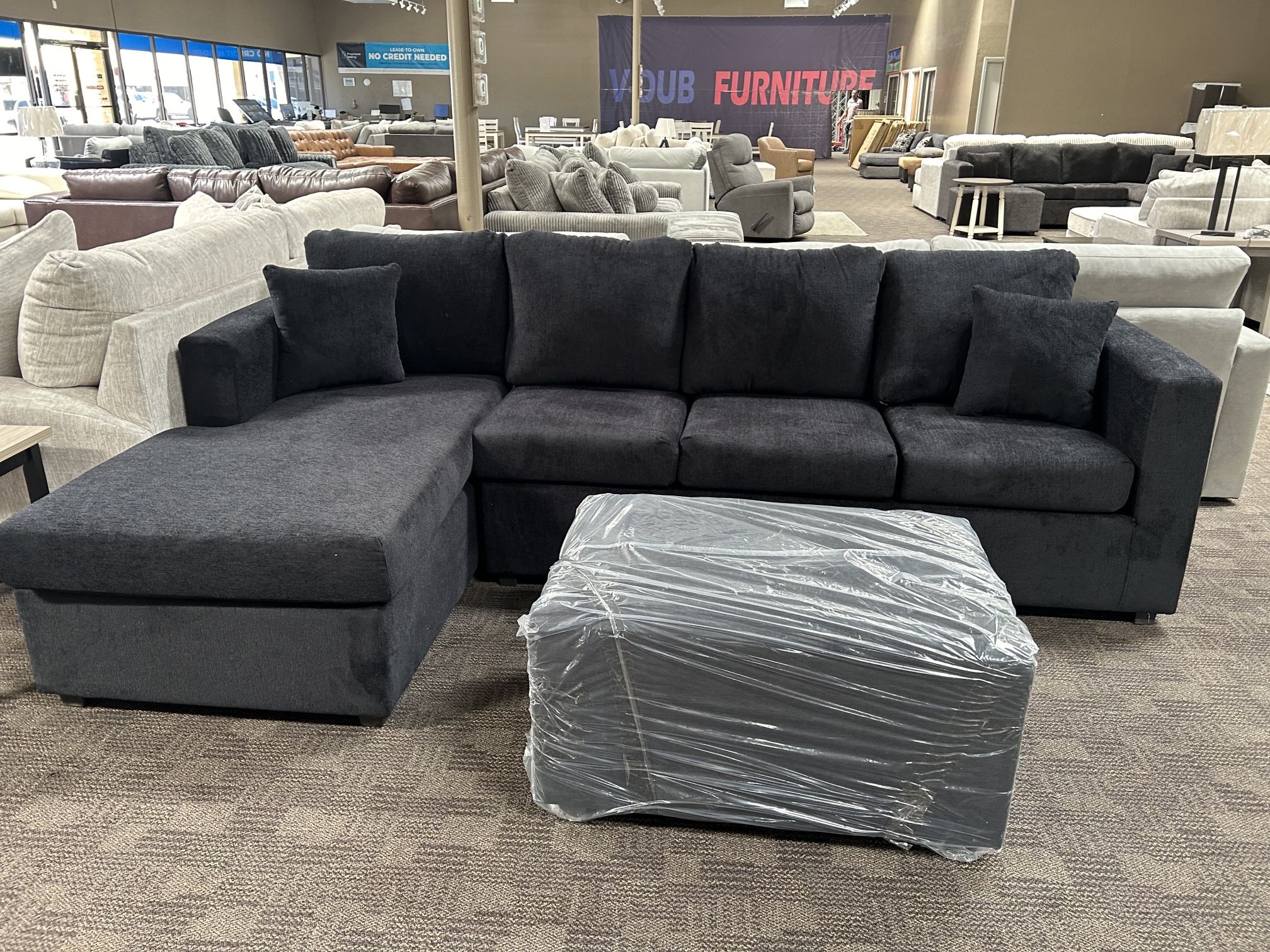 New Black Sectional And Ottoman