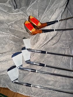 Vintage PowerBilt Grand Slam golf club set in excellent condition.
