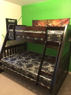 Brand new twin over full bunk bed. WITH MATS