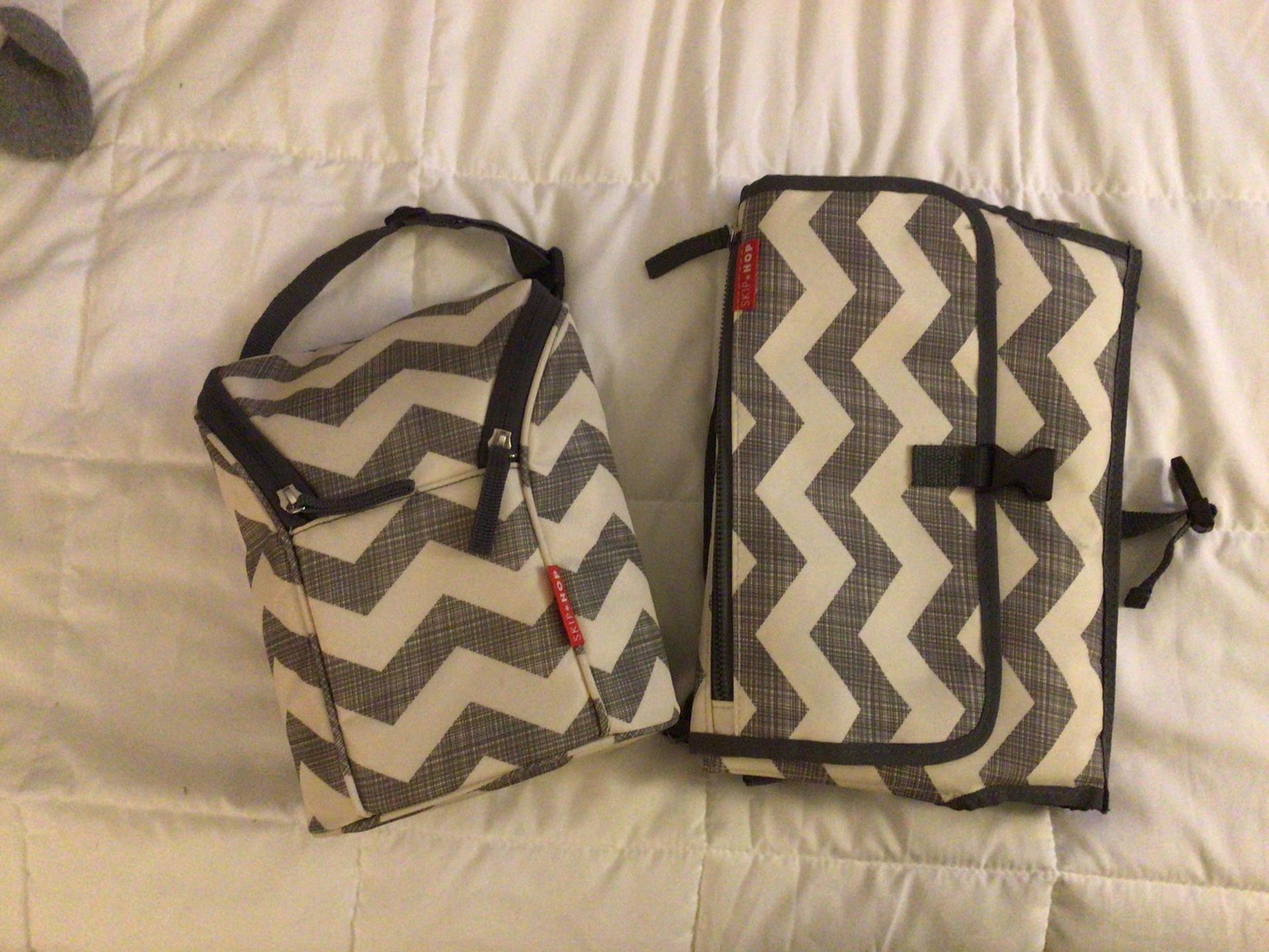 2 Peace baby diaper changing kit one piece is a foldable diaper changing pad the second piece is a snack bag or for Drinks