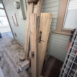 Reclaimed Barnwood lumber hand hewn wood beams for mantle table chairs bed frame heavy timber  Pile of wood for sale. Several pieces about 8ft long. T