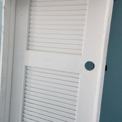 LOUVERED PRIMED BRAND  NEW DOOR WITH JAMB