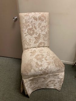 Cream colored padded, occasional chair
