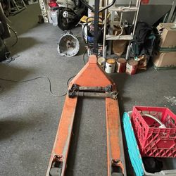  pallet jack, also known as a pallet truck. 