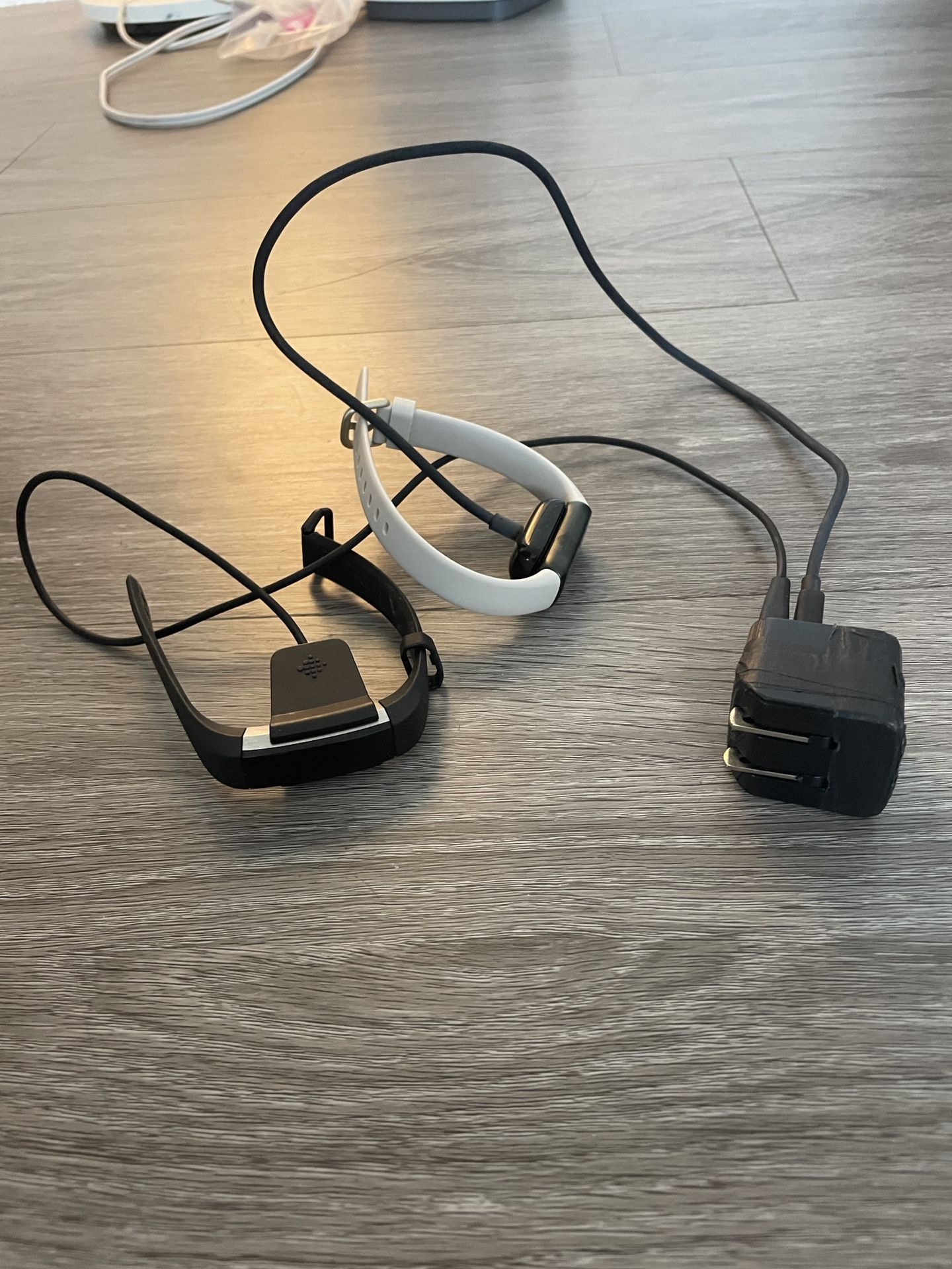2 Fitbits Plus Charger