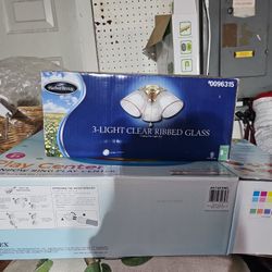 A Harbor Breeze Three Light Clear Rib Glass Ceiling Fan Light Kit