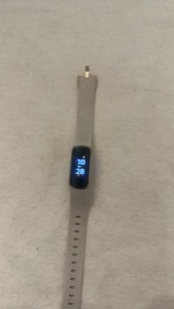 Fitbit watch with charger