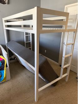 White metal loft bed with mattress