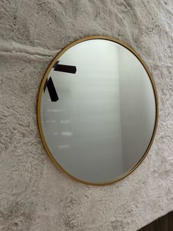 Gold round mirror