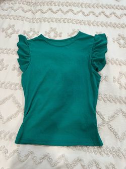 Women’s green ruffle top