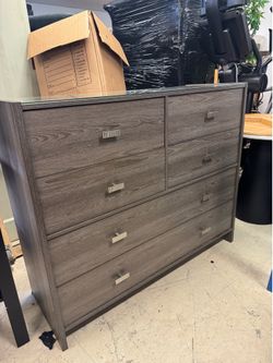 Made in Italy - 6-drawer dresser features a light grey wood grain finish and a glass top - 51” x 18” x 42” - Retail $1250