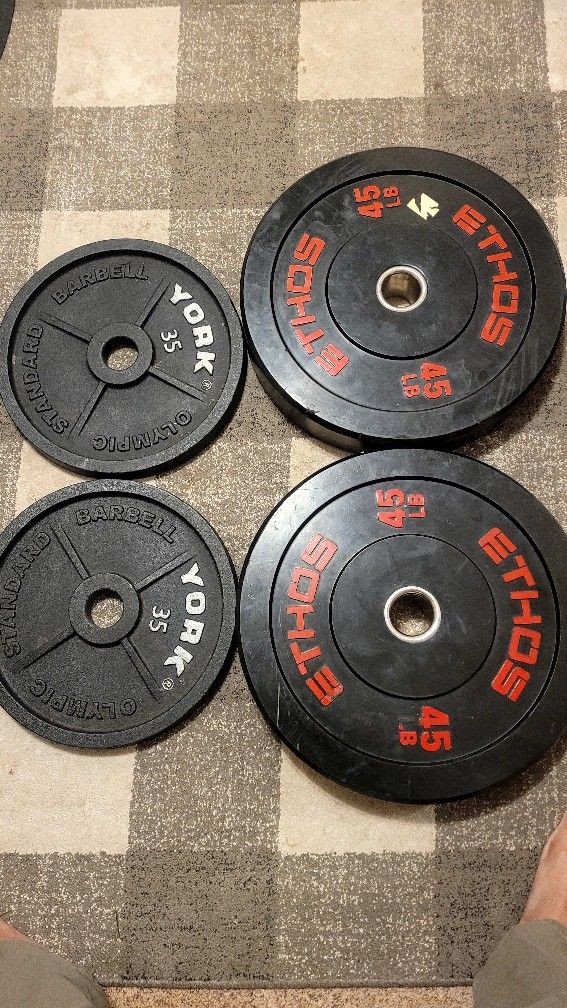 ETHOS Olympic Rubber Bumper Plate And York Barbell Cast Iron Olympic Plate Sets.