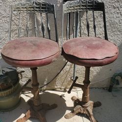 2 VINTAGE CAST IRON BAR STOOLS $50