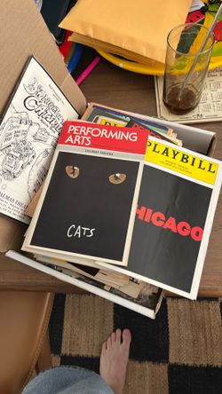 A stack of various vintage Playbills