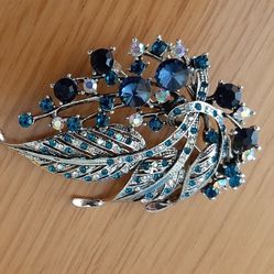 Beautiful Brooch with blue, green  stones.
