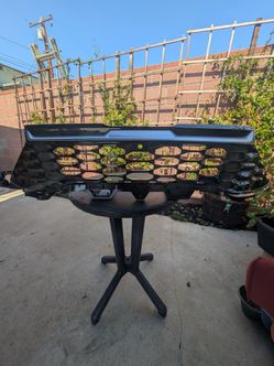 OEM 2023–2025 Kia Sportage front grille with the camera hole