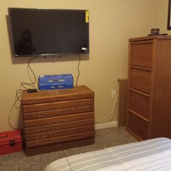 2 Bookshelves, 1small Dresser, Flat Screen TV.and 2 Oak Nite Stands